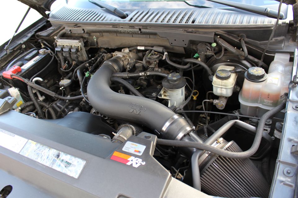 Engine bay of a 2003 Ford Expedition with a K&N air intake system installed