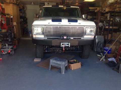 1978 Ford Bronco - Front view of a 1978 Ford Bronco parked in a garage, equipped with a winch.