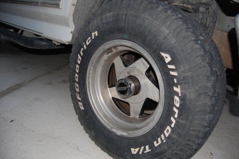 1994 Ford Bronco - Close-up of a tire and wheel assembly, showing the tread and rim details.