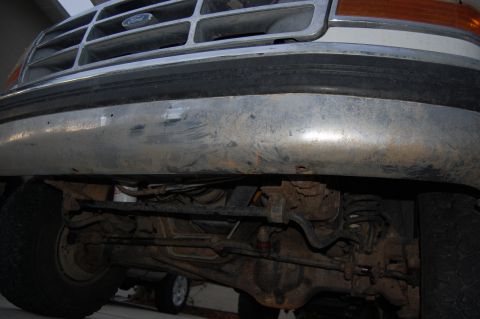 1994 Ford Bronco - Underside view of a Ford truck's front end, showing the grille and bumper.