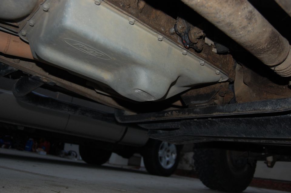 Underside of 1994 Ford Bronco showing oil pan with Ford logo