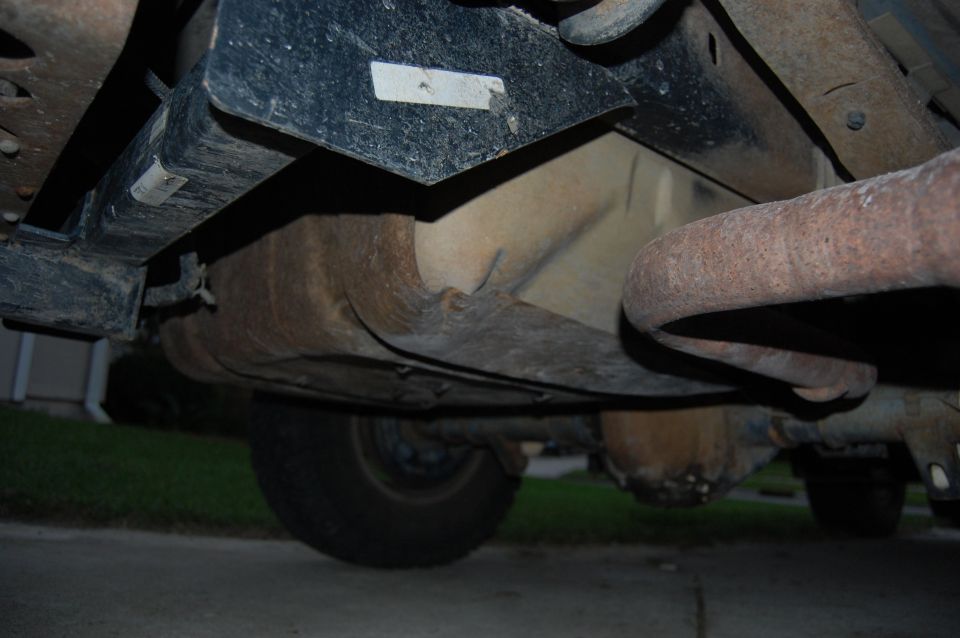 Undercarriage of 1994 Ford Bronco showing exhaust and fuel tank