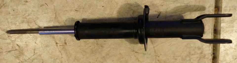 Black shock absorber with a silver piston rod and two mounting brackets on the right