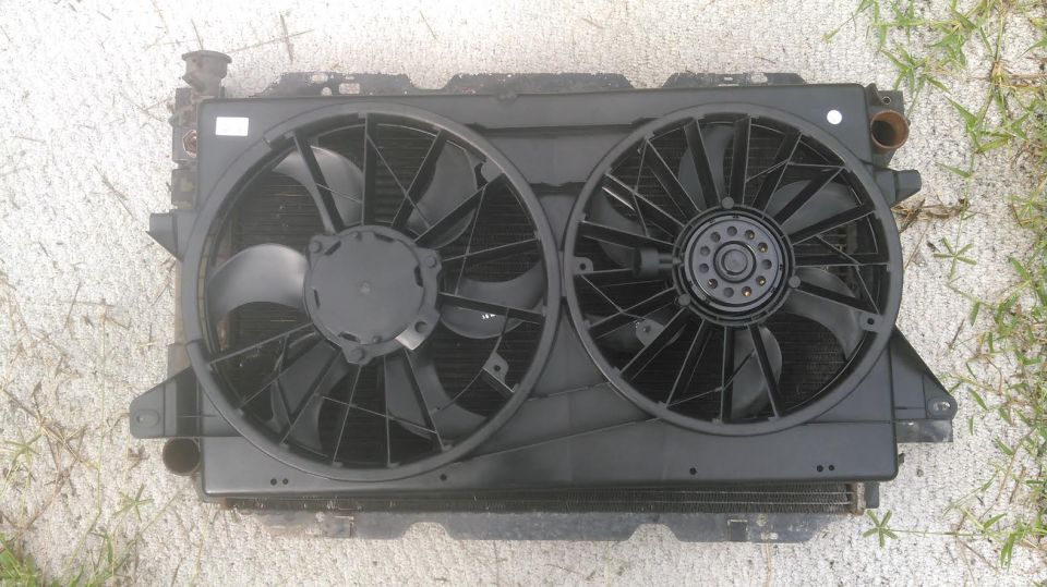 Dual electric fans from a 04-07 Ford Freestar. its Dorman 620-144 and cost about ~120$ depending on supplier

this is on a 80-96 bronco/f-series radiator for size comparison. it coers pretty much all the finned area of the radiator and is alittle wide but can be made to work.

this is it on the inside of the radiator. it will need some modifinig here and there. cutting the tabs off, notche the shroud for the hoses and tranny cooler lines.