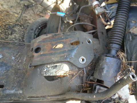 1994 Ford Bronco - This image shows a section of a vehicle's undercarriage, focusing on the frame and suspension components.