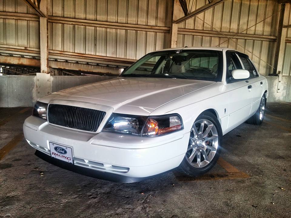 White 2000 Mercury Grand Marquis with a Ford Racing license plate frame