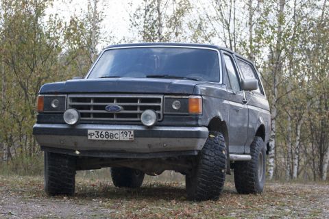 1987 Ford Bronco - This 1987 Ford Bronco is shown from the front in an outdoor setting.