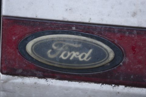 1987 Ford Bronco - A Ford emblem is visible on the vehicle's exterior panel.