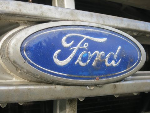 1987 Ford Bronco - Close-up of the Ford emblem on the grille of a 1987 Ford Bronco.