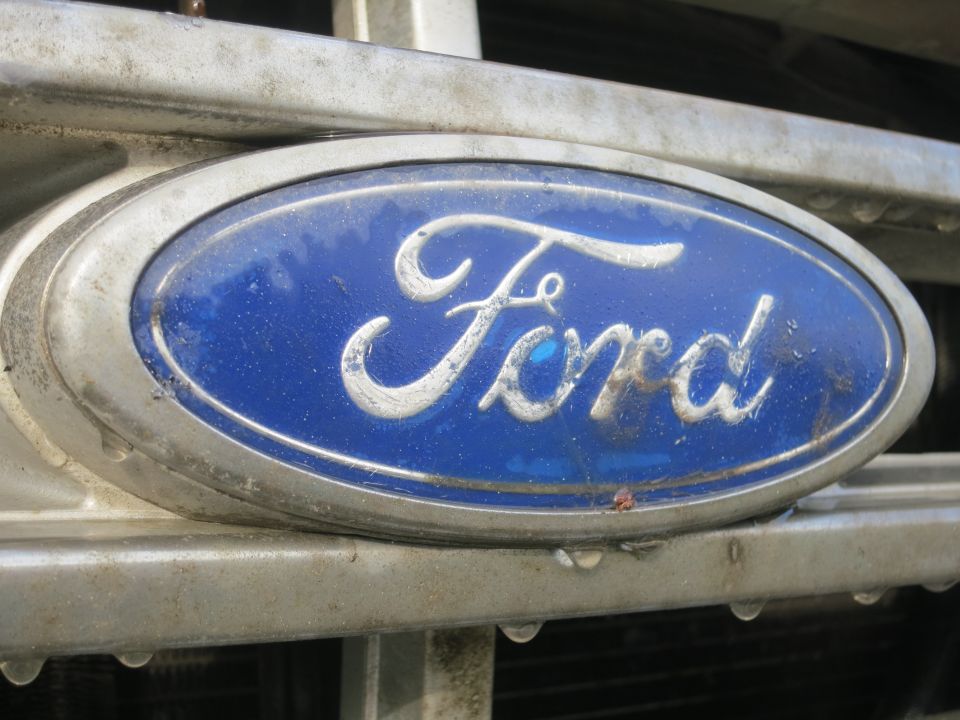 Close-up of 1987 Ford Bronco grille with blue Ford emblem