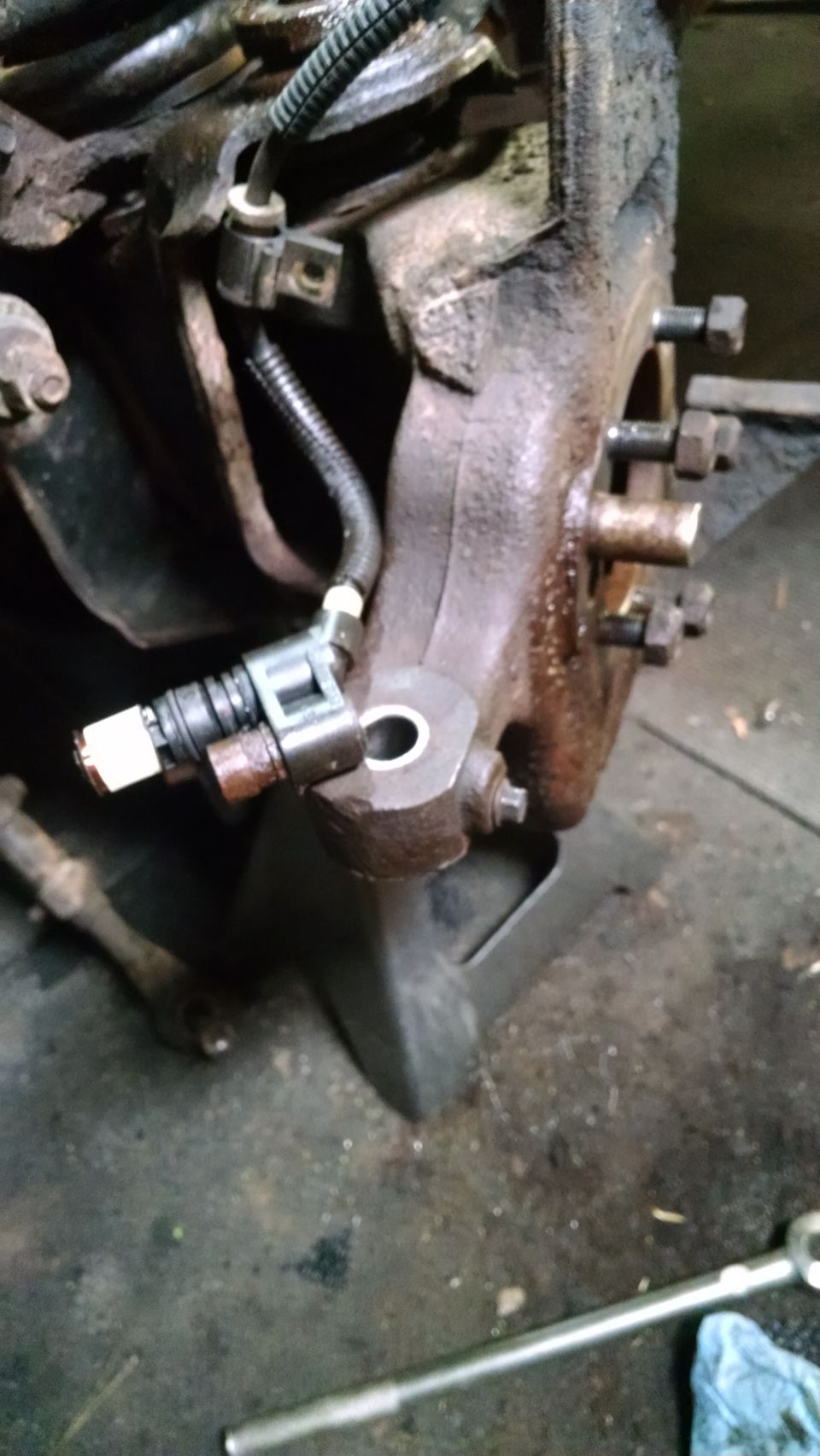 Wheel speed sensor attached to vehicle suspension assembly