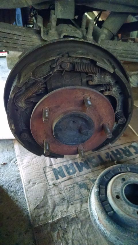 1994 Ford Bronco - Close-up of a vehicle's rear drum brake assembly, showing the hub and brake shoes.