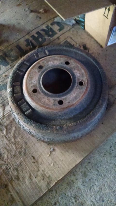 1994 Ford Bronco - A close-up view of a worn brake drum, likely for an older vehicle.