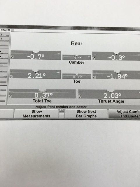1996 Ford Bronco - This document displays rear wheel alignment data, including camber, toe, and thrust angle readings.