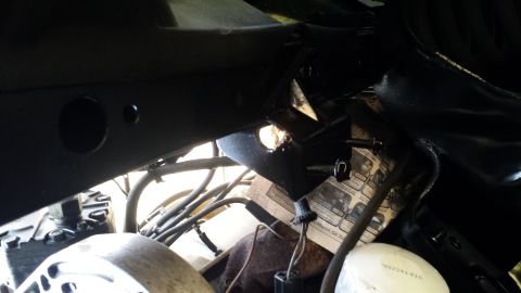1980 Ford Mustang - Close-up view of a vehicle's undercarriage, showing mechanical components and wiring.