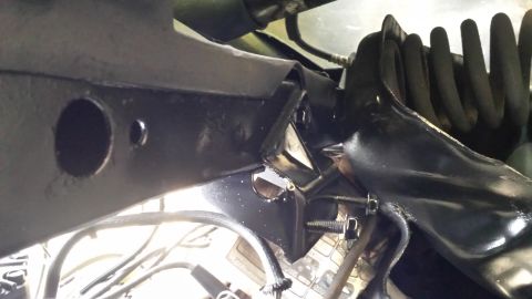 1980 Ford Mustang - Close-up view of a black suspension component, likely part of a vehicle's steering or suspension system.
