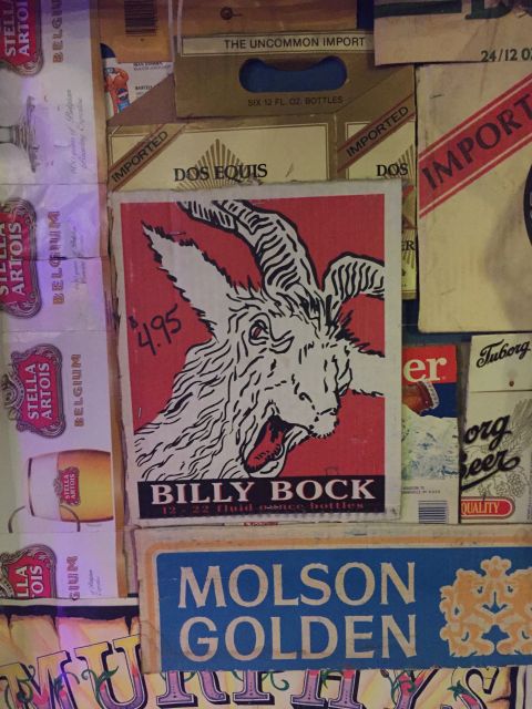1946 Jeep Willys - A collection of beer advertisements and boxes are displayed, a prominent Billy Bock ad with a goat illustration.
