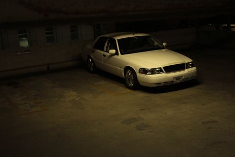 2000 Mercury Grand Marquis - Front 3/4 view of a white 2000 Mercury Grand Marquis parked in a garage.