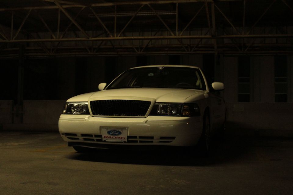 White Ford Crown Victoria with a Ford Racing plate in front