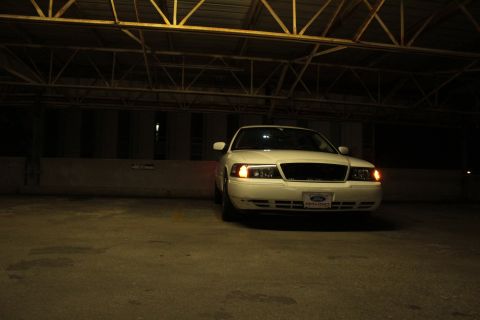 2000 Mercury Grand Marquis - White 2000 Mercury Grand Marquis parked under a covered structure.