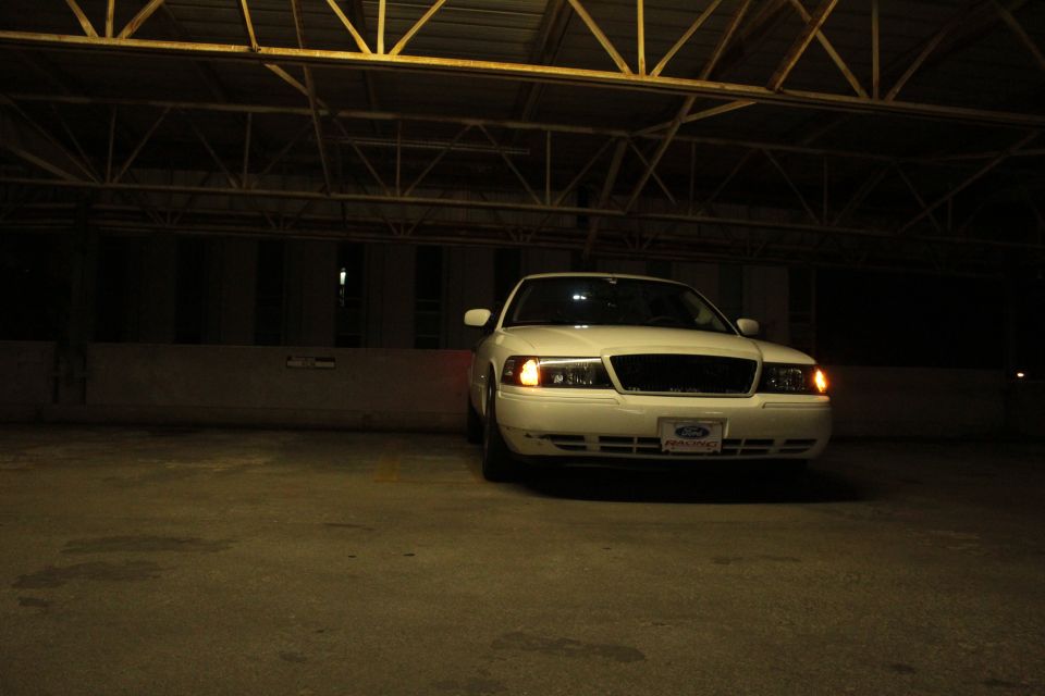 2000 Mercury Grand Marquis parked indoors at night. Front view