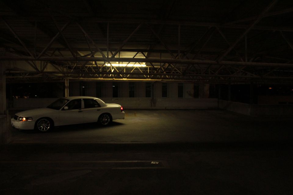 2000 Mercury Grand Marquis parked under industrial lighting