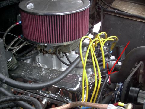 1986 Ford Bronco - Close-up view of an engine bay, highlighting the air intake and ignition system components.
