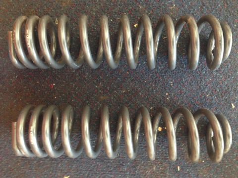 1996 Ford Bronco - Two gray coil springs are shown, with text visible on the upper spring.