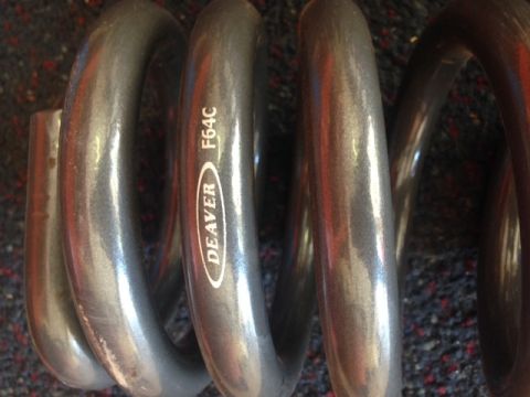 1996 Ford Bronco - A close-up shows a coil spring with the DEAVER F64C marking.