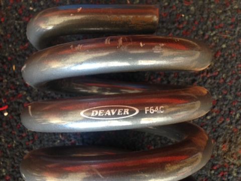 1996 Ford Bronco - Close-up of a Deaver F64C coil spring, likely a suspension component.