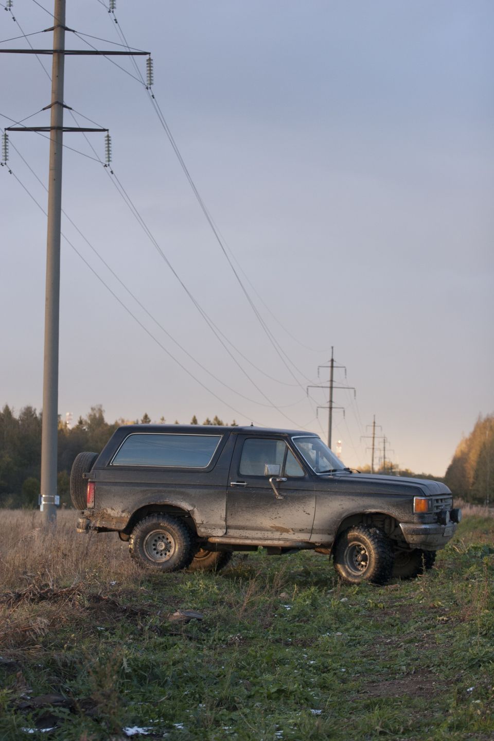 1987 Ford Bronco side view in a field