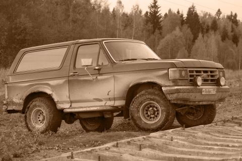 1987 Ford Bronco - This 1987 Ford Bronco is captured in a three-quarter front view, its classic SUV design.