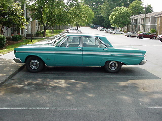 Teal 1964 Mercury Comet sedan, side view