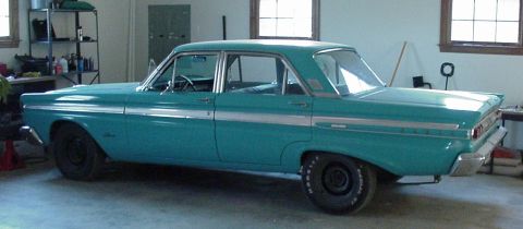 1964 Mercury Comet - This 1964 Mercury Comet sedan is seen from its rear three-quarter view in a garage setting.