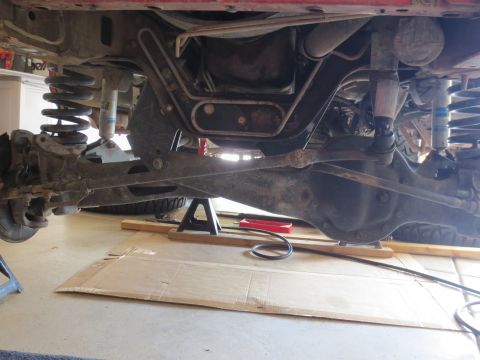 1996 Ford Bronco - Vehicle suspension and frame components are visible while the vehicle is supported by jack stands.