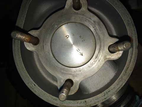 1988 Ford Bronco - Close-up view of an engine cylinder and piston, stamped markings 'A' and 'N12'.