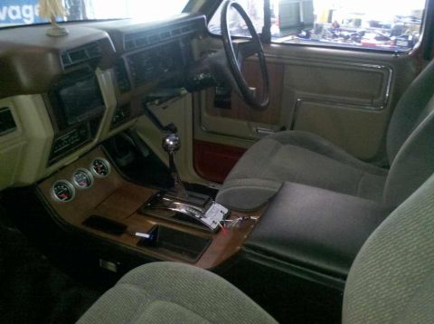 1982 Ford Bronco - The interior of a 1982 Ford Bronco shows custom gauges and a prominent shifter, suggesting a rebuild or modification project.