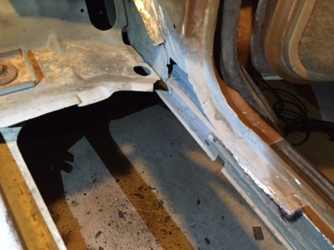 1991 Ford Bronco - This photo shows significant rust damage to the floor pan and frame of a vehicle, indicating structural compromise.