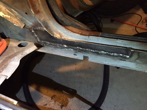 1991 Ford Bronco - Newly welded metal reinforces a section of the vehicle's frame, indicating repair work.