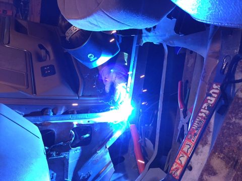 1991 Ford Bronco - Welding is performed on the floor pan of a 1991 Ford Bronco.