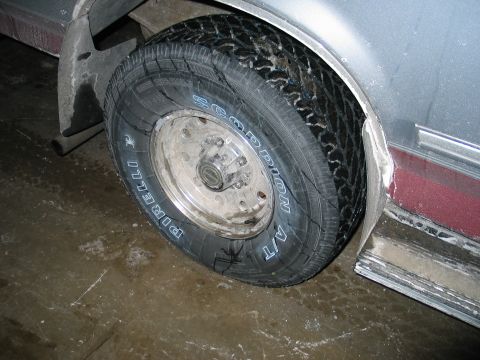 1995 Ford Bronco - Close-up of a tire and wheel on a vehicle, showing the Pirelli Scorpion A/T tread pattern.