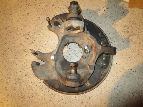 1996 Ford Bronco - This is a front wheel knuckle assembly, likely for a truck or SUV, showing the ball joint and brake components.