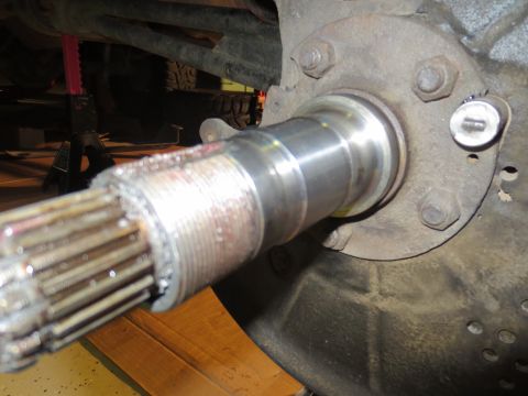 1996 Ford Bronco - Close-up of a vehicle's splined axle shaft and hub assembly, showing wear and metal debris.