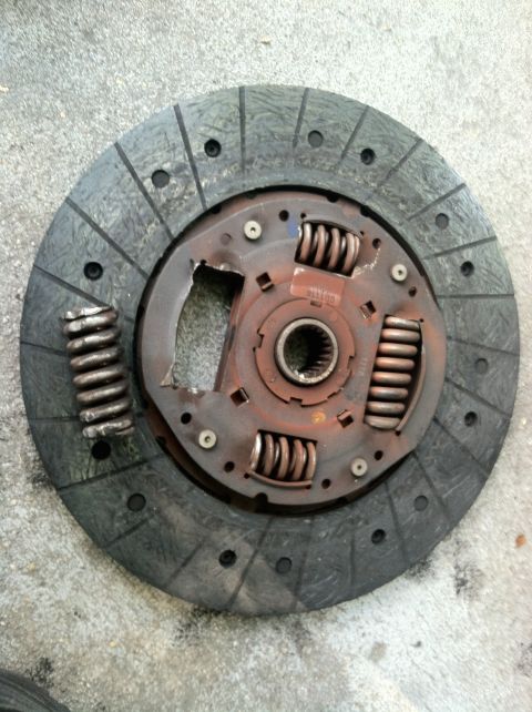 1993 Ford Taurus - Clutch disc showing signs of wear and damage, including broken springs.