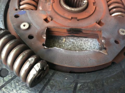 1993 Ford Taurus - This clutch pressure plate shows significant wear and damage to its springs and metal housing.