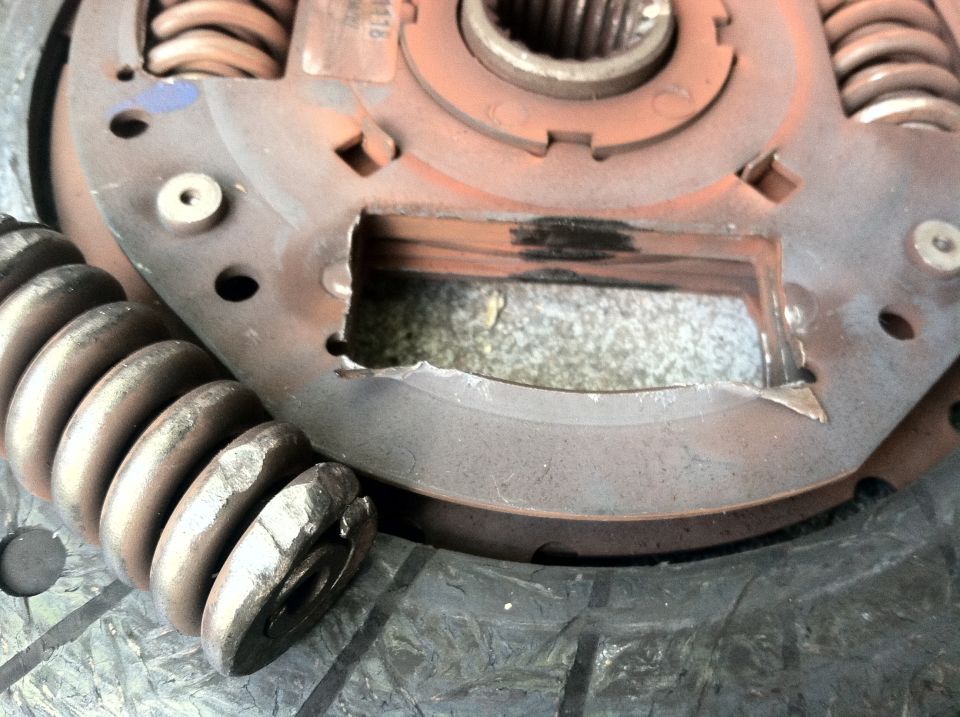Clutch pressure plate with broken springs and damaged metal