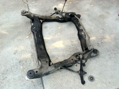 1993 Ford Taurus - Removed subframe assembly with suspension parts, likely from a front-wheel-drive car.