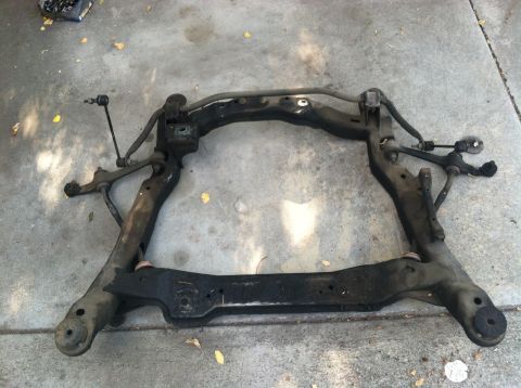 1993 Ford Taurus - This is a front subframe assembly, likely removed from a vehicle for repair or replacement.