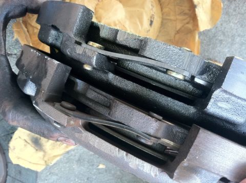 1993 Ford Taurus - Two brake caliper assemblies are shown, likely for a vehicle repair or replacement.