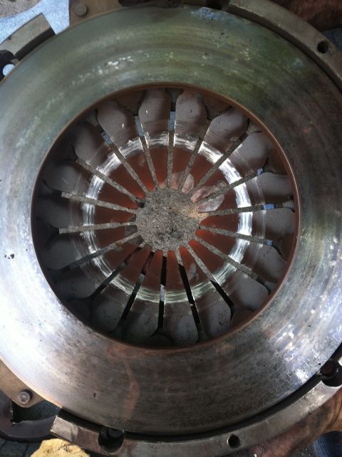 1993 Ford Taurus - This is a close-up view of a vehicle's clutch pressure plate, showing signs of wear and tear.